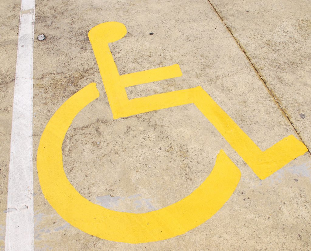 handicap parking painting on the floor of a parking lot